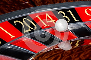 Classic casino roulette wheel with red sector four