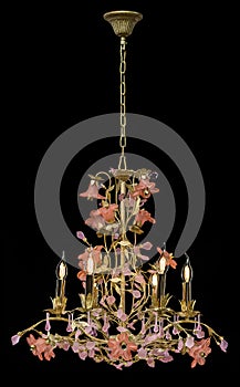 Classic chandelier in flower style isolated on black background.