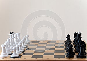 Classic chess pieces on a chessboard. Copy space for text. Chess match. The concept of a successful team work leader. Business