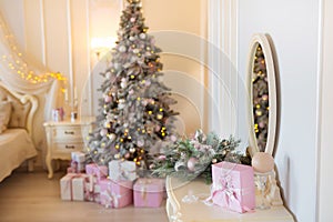 Classic Christmas decorated interior room with New year tree. Modern luxury design apartment bedroom with bed. Christmas