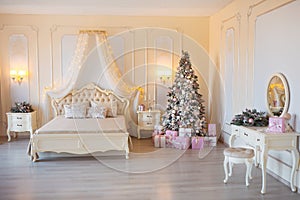 Classic Christmas decorated interior room with New year tree. Modern luxury design apartment bedroom with bed. Christmas