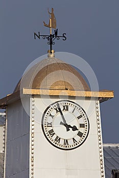 Classic clock tower with weather vane