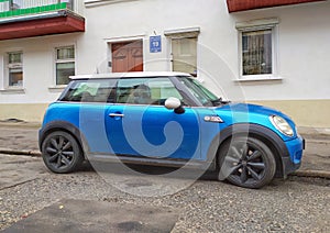 Classic compact car blue Mini Cooper parked