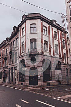 Classic Corner Building in Dinant, Belgium with Retail Storefront