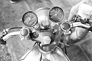 Classic custom metal motorcycle steering wheel handlebar with tachometer and speedometers