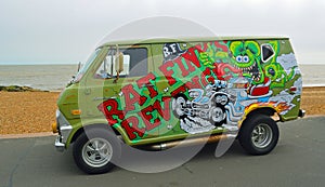 Classic Customised Ford Econoline 100 Van parked on seafront promenade.