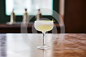 classic daiquiri cocktail, frosty with a sugared rim on a bar counter