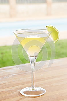 Classic daiquiri cocktail by a pool outdoors