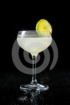 Classic daiquiri on the dark background. Luxury craft drink.