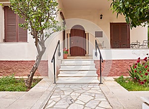 A classic design house cosy entrance path and stairs through the garden.