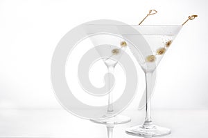 Classic Dry Martini with olives isolated on white background.