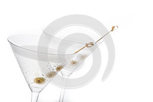 Classic Dry Martini with olives isolated on white background.