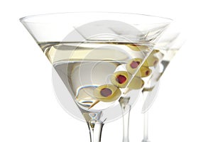 Classic dry martini with olives isolated on white in a line,close-up
