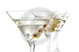 Classic dry martini with olives isolated on white in a line,close-up