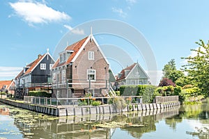 Classic Dutch houses at the waterside, at the town of Marken