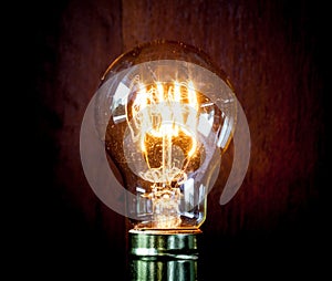 Classic Edison light bulb with looping carbon filament.