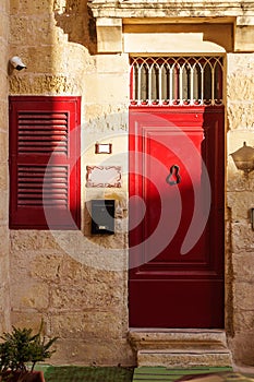 Classic facade with red vintage door