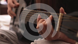 Classic girl playing the guitar. musician acoustic instrument concept. guitarist girl hands close-up playing near