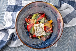 Classic Greek salad. Natural delicious food. Greek cuisine menu. Still life in a marine style