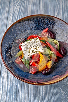 Classic Greek salad. Natural delicious food. Greek cuisine menu. Still life in a marine style