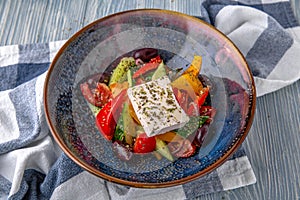 Classic Greek salad. Natural delicious food. Greek cuisine menu. Still life in a marine style