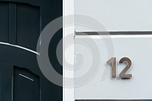 Classic green door with number 12. Vintage style