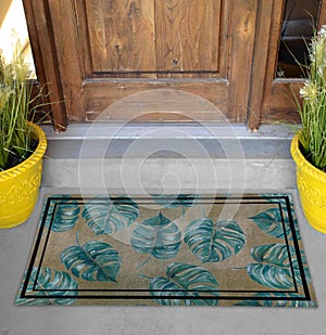 Classic green leaves Outdoor Door mat with twin black borders outside home with yellow flower pots