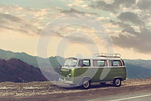 Classic Green Vintage Camper Van Parked on Road.