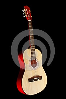 Classic guitar against black background