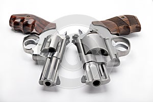 Classic guns , Revolver pistol handguns on white surface background