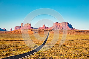 Classic highway view in Monument Valley at sunset, USA