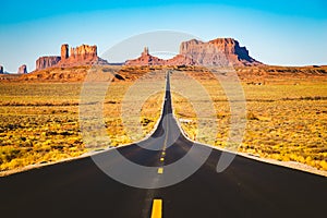 Classic highway view in Monument Valley at sunset, USA