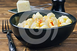 Classic Homemade Macaroni and Cheese on black bowl