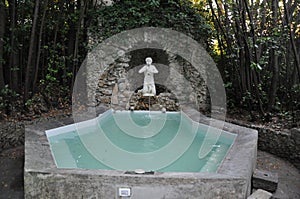 Classic hottub outdoor grotto Tuscan villa Italy