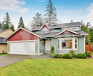 Classic house with garage and driveway.