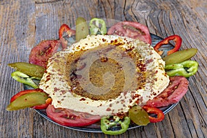 Classic hummus with parsley on the plate and pita bread. Hummus Chickpea. Bowl of arabic or lebanese vegetarian hummus