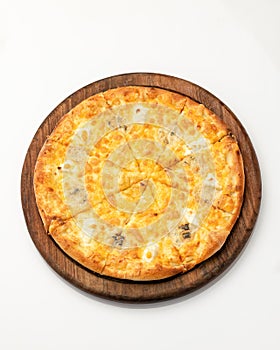 Classic italian pizza isolated on white background. Whole cheese pizza on round cutting board. Nutrition dinner or lunch