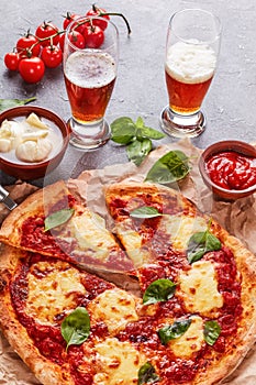 Classic italian Pizza Margherita and beer