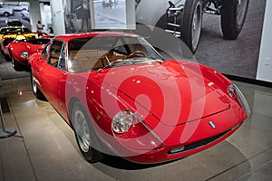 Detail of a classic Italian supercar, 1967 De Tomaso Vallelunga in red color