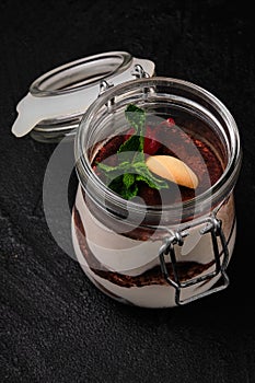 Classic Italian tiramisu dessert served in a jar