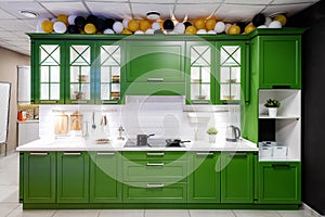 Classic kitchen interior with green trim. Kitchen acrylic countertop with built-in sink