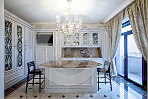 Classic kitchen interior with panoramic window and islands