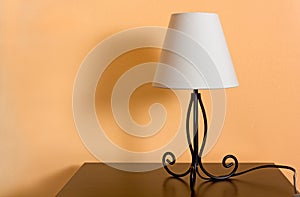 Classic Lamp on a Wooden Bedside Table photo