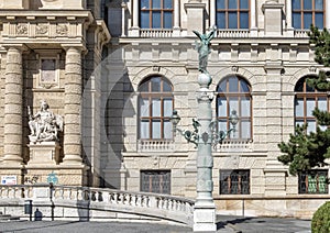 Classic lampost topped with bronze green angel statue, front of the Natural History Museum, Maria-Theresien-Platz, Vienna, Austria