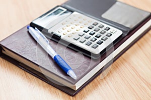 Classic leather notebook with pen and calculator