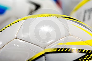 Classic leather soccer ball scored a goal on stadium blur background