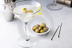 Classic lemon drop martini with olives and lemon