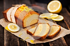 Classic lemon pound cake on rustic wooden background