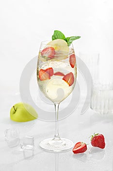 Classic lemonade mix in glass on white background with Aloe Vera jam with honey, green apple, sparkling water, lime