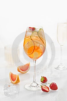 Classic lemonade mix in glass on white background with grapefruit, cucumber, strawberry  soda and orange